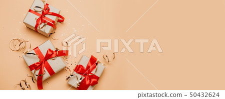 Gift or present box and golden decorations on Gift or present box and golden decorations on 50432624