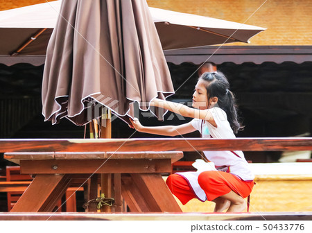 Asian girl raise an umbrella, Students or Children Asian girl raise an umbrella, Students or Children 50433776