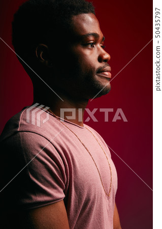 Serious black Afro American man with thoughtful expression looking at camera Serious black Afro American man with thoughtful expression looking at camera 50435797