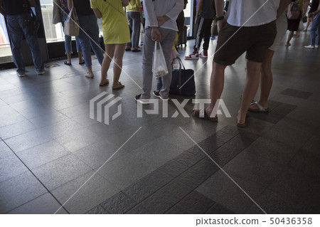 People waiting in line queue 50436358