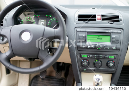 Modern car dashboard, steering wheel, radio system 50436530