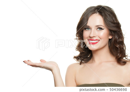 Happy beautiful woman holding empty open hand Happy beautiful woman holding empty open hand 50436698