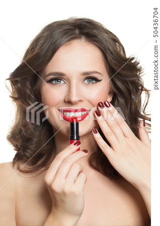 Happy woman with red manicured nails, lipstick  50436704