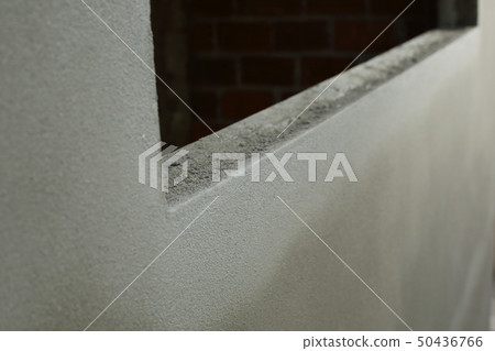 window frame on cement wall inside construction 50436766
