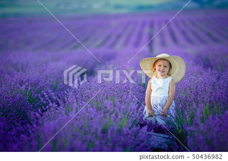 A Portrait of an adorable toddler girl in a magic fairy costume with curly hair playing with a wand A Portrait of an adorable toddler girl in a magic fairy costume with curly hair playing with a wand 50436982