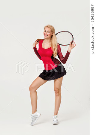 Female tennis player with tennis racket Female tennis player with tennis racket 50436997