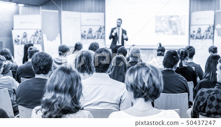 Business speaker giving a talk at business conference event. 50437247