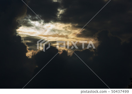 heaven light in dramatic sky with dark cloud heaven light in dramatic sky with dark cloud 50437499