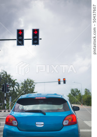 car driving stopped on crossroad with red traffic 50437607