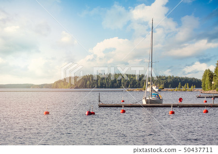 Yacht near the mini pier on Lake in Finland.  50437711