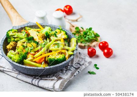 Fried broccoli, peppers, corn, zucchini Fried broccoli, peppers, corn, zucchini 50438174