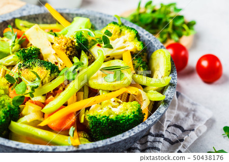 Fried broccoli, peppers, corn, zucchini Fried broccoli, peppers, corn, zucchini 50438176