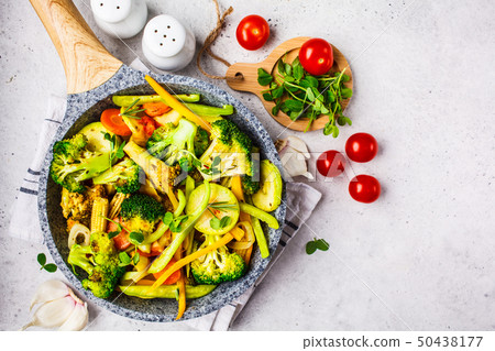 Fried broccoli, peppers, corn, zucchini  50438177