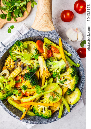 Fried broccoli, peppers, corn, zucchini  50438178