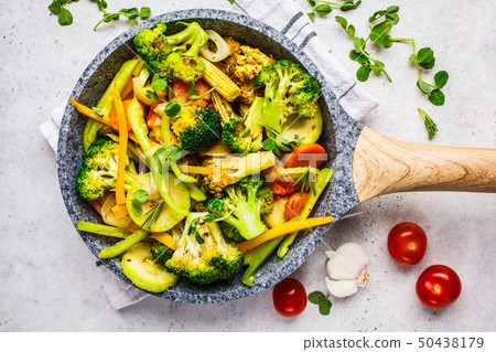 Fried broccoli, peppers, corn, zucchini Fried broccoli, peppers, corn, zucchini 50438179
