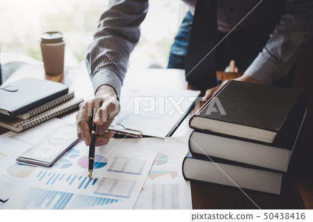 Businessman pointing at graph and chart to 50438416