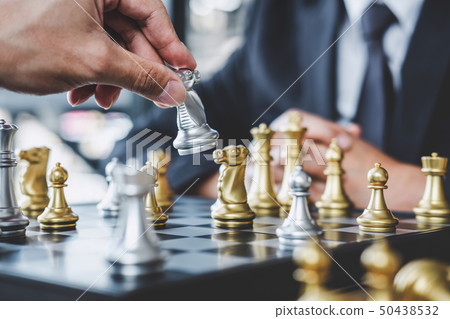 Two businessman playing chess game to plan Two businessman playing chess game to plan 50438532