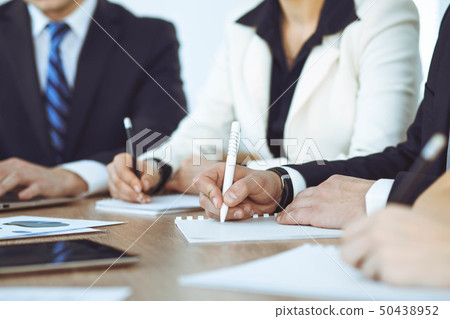 Group of business people or lawyers work together at meeting in office, hands using tablet and 50438952