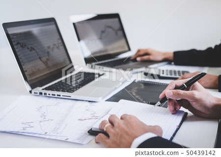 Business team investment working with computer and Business team investment working with computer and 50439142