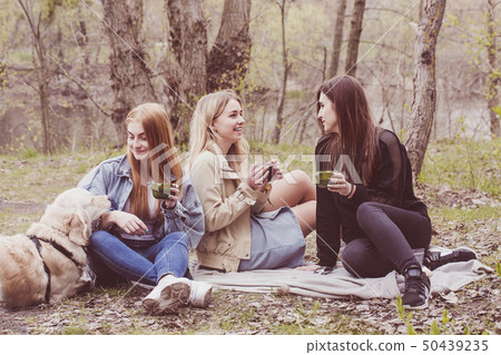 a girl chatting over a cup of cocoa 50439235