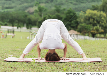 woman practice yoga Spread foot stretching pose 50439271