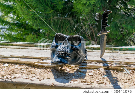 scary skull mask and old battle knife 50441076