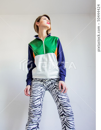 Young girl in zebra pants and 90s style jacket 50444424