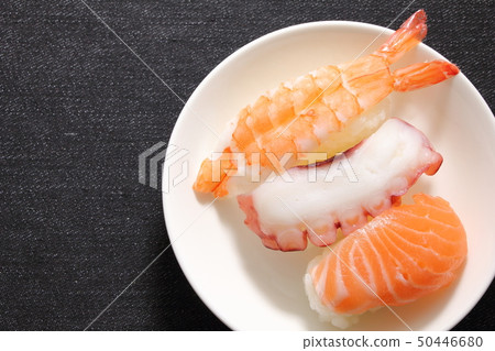 Sushi Nigiri 3 (Salmon, Tako, Shrimp). Japanese-style sushi with Western-style casual denim cloth table cloth. Sushi Nigiri 3 (Salmon, Tako, Shrimp). Japanese-style sushi with Western-style casual denim cloth table cloth. 50446680