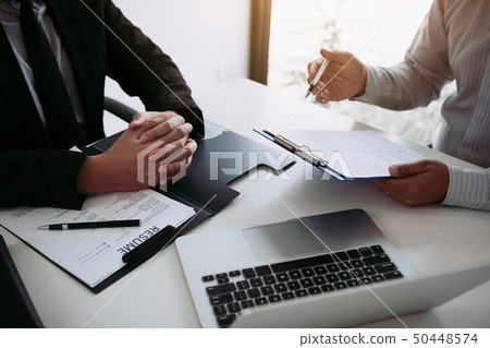 Men are describing the employment history of the Men are describing the employment history of the 50448574