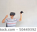 Asian Elderly men are enjoying vr technology 50449392