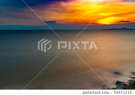 Sunset at sea and beautiful clouds Sunset at sea and beautiful clouds 50451218