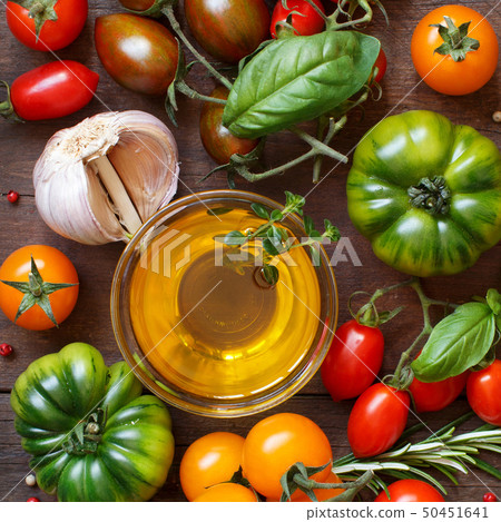 Colorful tomatoes, garlic, olive oil and herbs 50451641