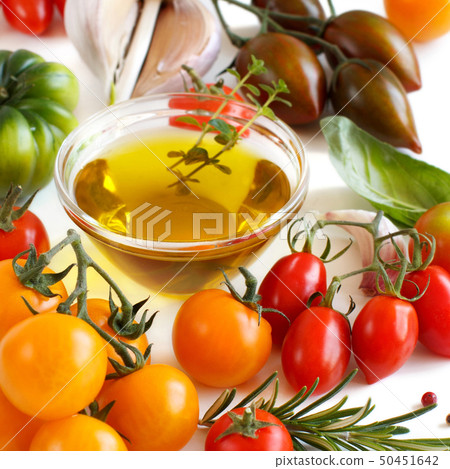 Colorful tomatoes, garlic, basil and oilve oil 50451642
