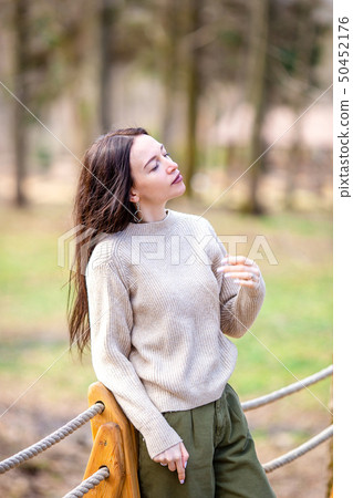 Woman relaxing in the forest on weekeend Woman relaxing in the forest on weekeend 50452176