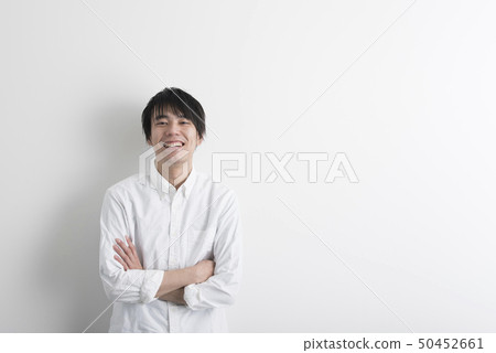Young man smile white background 50452661