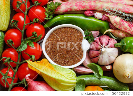 Uncooked teff grain with vegetables Uncooked teff grain with vegetables 50452952