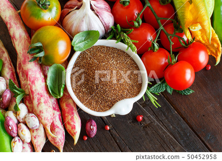 Uncooked teff grain with vegetables Uncooked teff grain with vegetables 50452958
