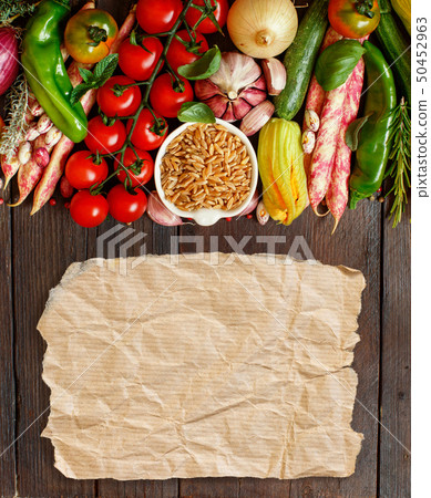 Uncooked kamut grain with vegetables 50452963