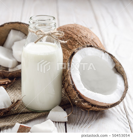 Glass bottle of milk or yogurt on hemp napkin on 50453054