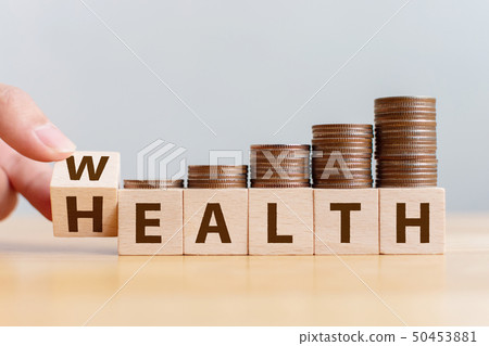Hand flip wooden cube with word wealth to health 50453881
