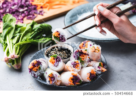 Eating Asian Cuisine Spring Rolls 50454668