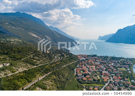 Aerial view on Nago Torbole city and Sarca River. 50454990