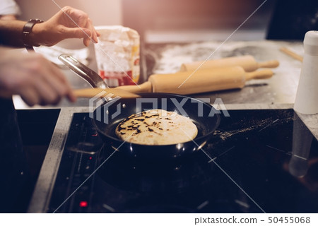 Frying traditional imeruli on frying pan in the 50455068