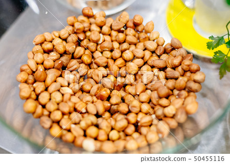 Raw hazelnuts in the glass bowl Raw hazelnuts in the glass bowl 50455116