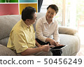 Portrait of happy old loving couple smiling 50456249