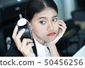 Asian business woman feeling tired and bored 50456256