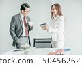 Business people having fun and talking at 50456262