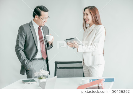 Business people having fun and talking at 50456262