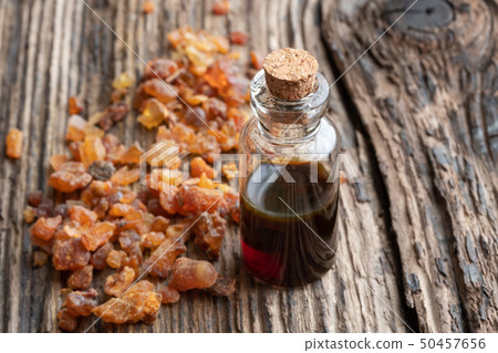 A bottle of myrrh essential oil with myrrh resin 50457656