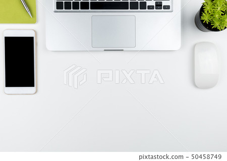 White office desk table with laptop and supplies. White office desk table with laptop and supplies. 50458749